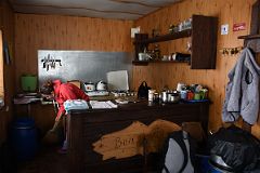 03B Our Cook Cleaning Up In The Kitchen At Garabashi Camp 3730m To Climb Mount Elbrus.jpg